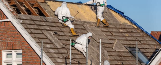 Professionals In Protective Suits Remove Asbestos
